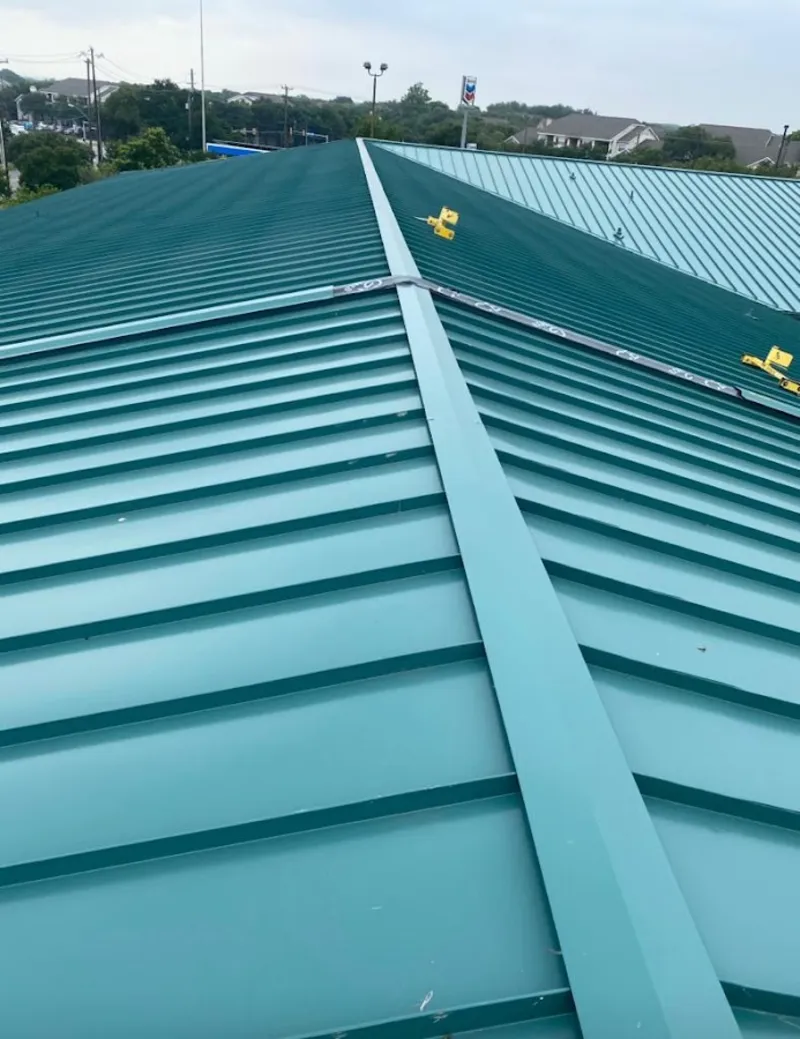 Green commercial metal roof ridge and valley for Metal Roof Repair in Floral Park